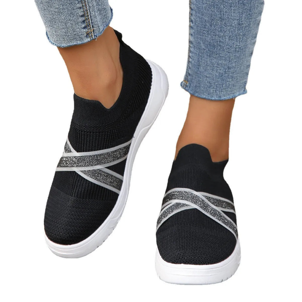 Women's black flat bottom flyknit mesh shoes with tassel detail, round toe, and rubber sole