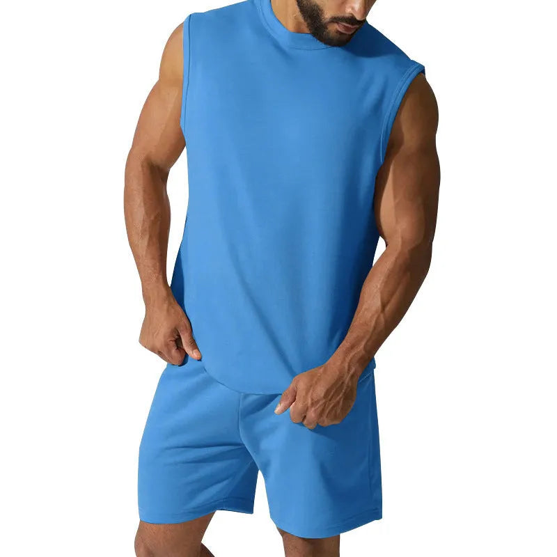 Men's sleeveless cotton blend sports top and shorts set in a solid colour on a mannequin.