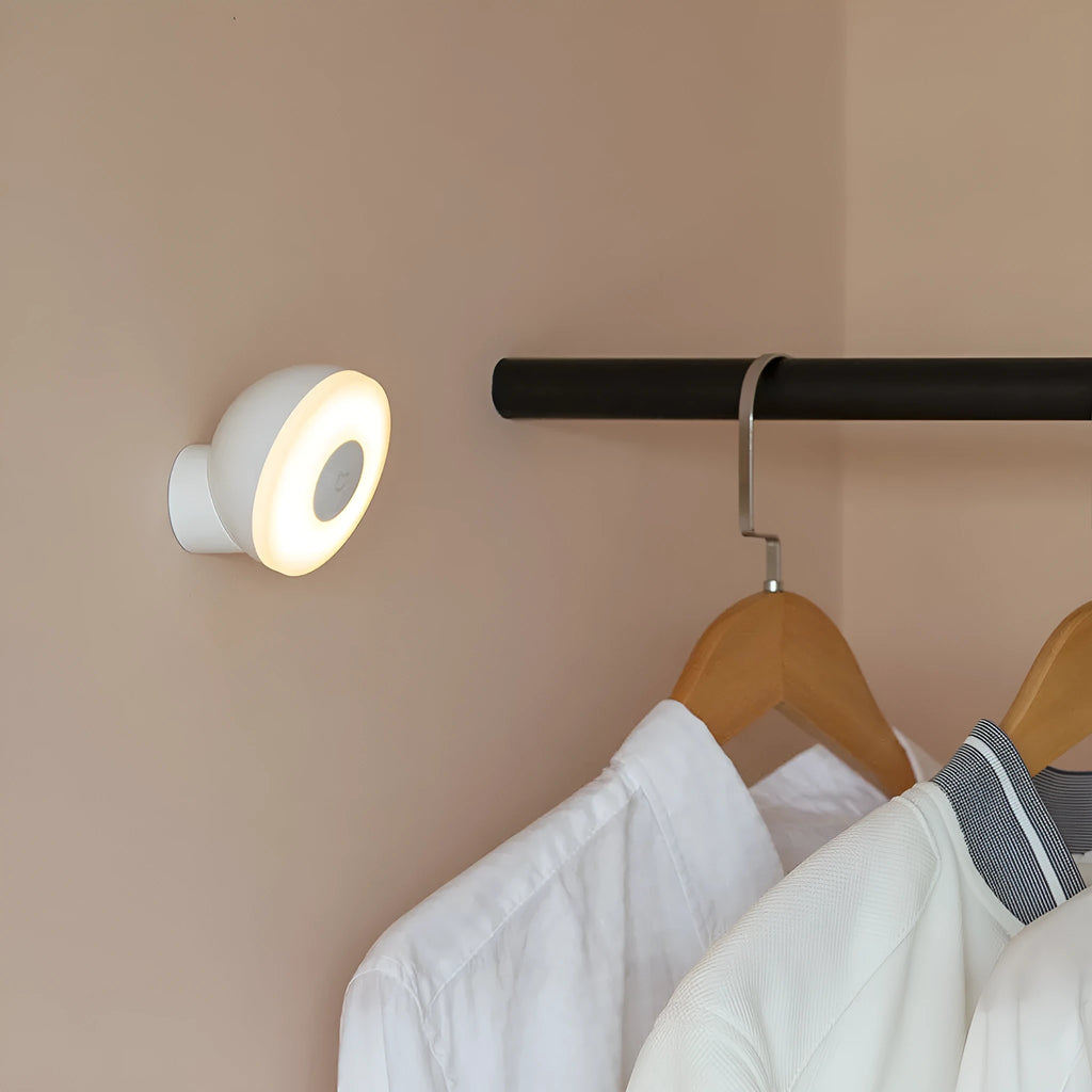 White modern bedside table lamp with human body induction and Bluetooth connectivity.