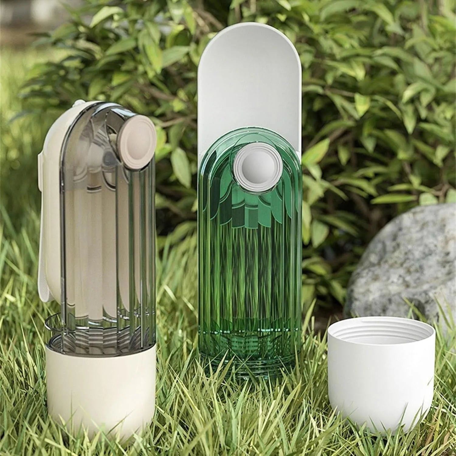 Beige and green foldable dog water bottle with integrated food container at the base