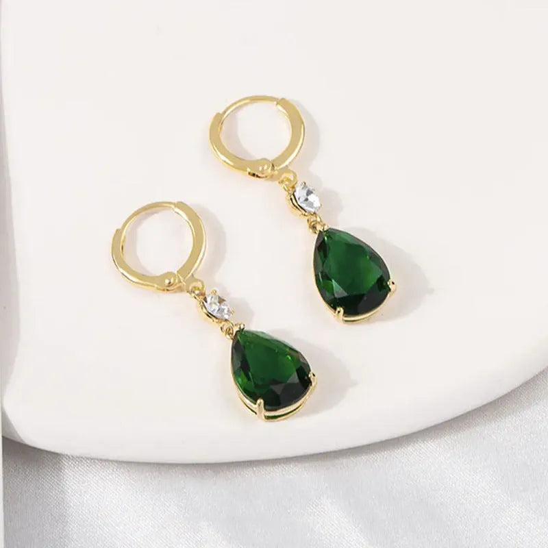 A pair of green geometric teardrop earrings made from alloy metal.