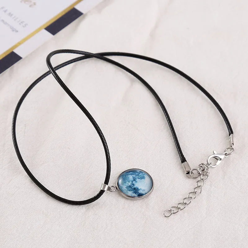 Christmas constellation pendant necklace with luminous alloy chain and blue night sky glass pendant.