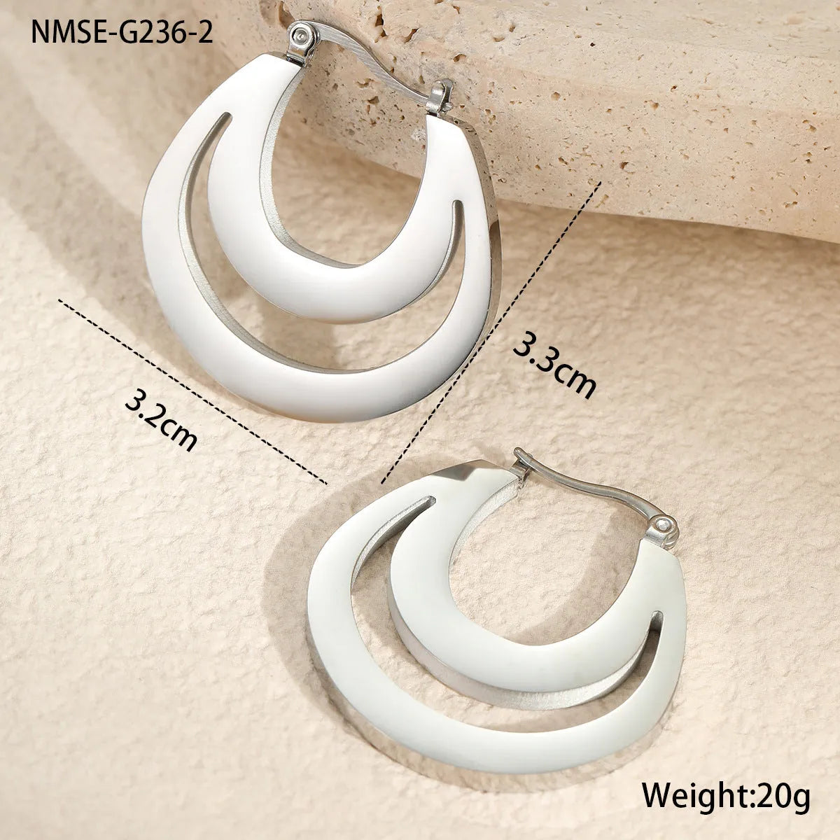 Geometric French earrings with 18K gold plating on stainless steel, featuring round ring elements in minimalist design