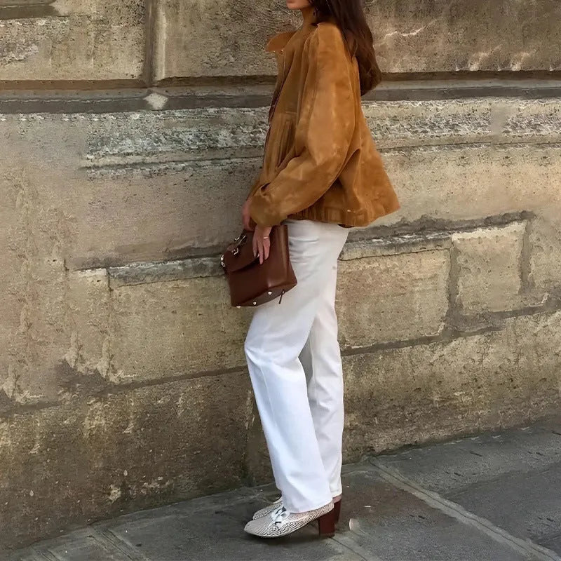 Loose-fit solid colour polyester jacket with long sleeves on a model.
