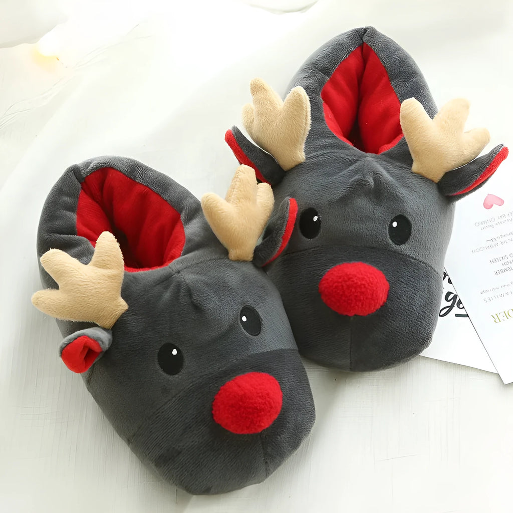 Grey super soft fleece home slippers with cute elk design, placed on a floor