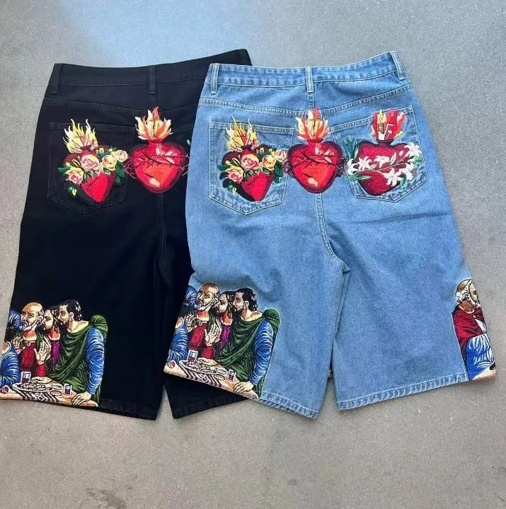 Men's blue cotton shorts with a printed design on the back pocket, showing tapered leg fit.