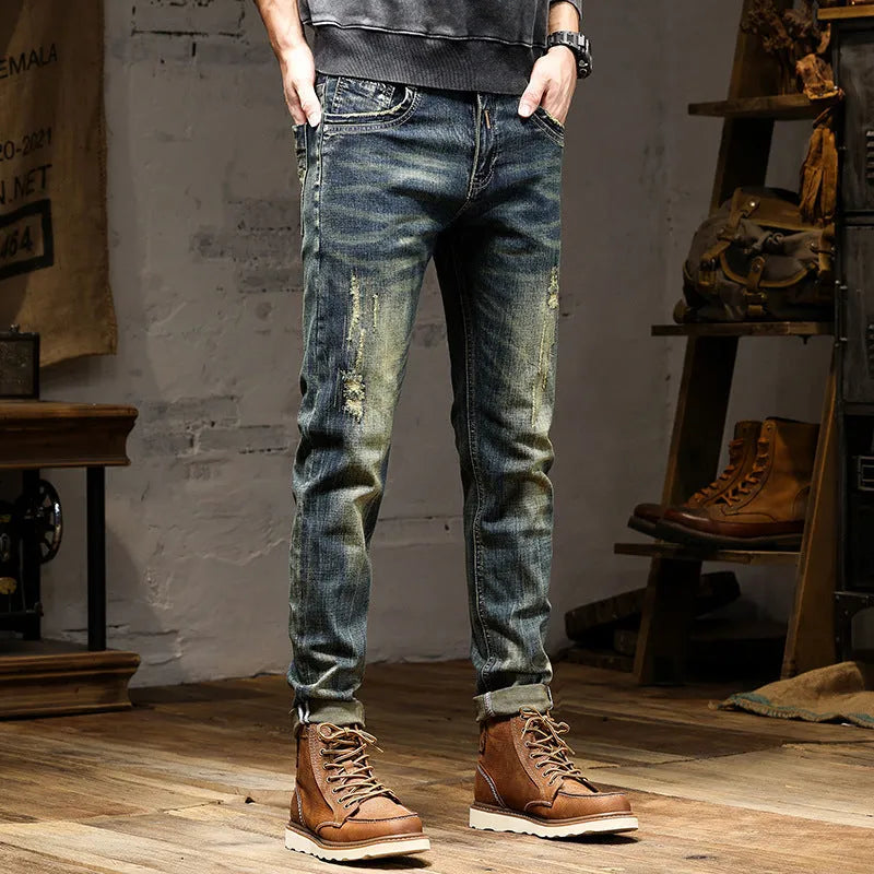 Men's skinny fit jeans in retro colour showing zip fly and tapered leg.