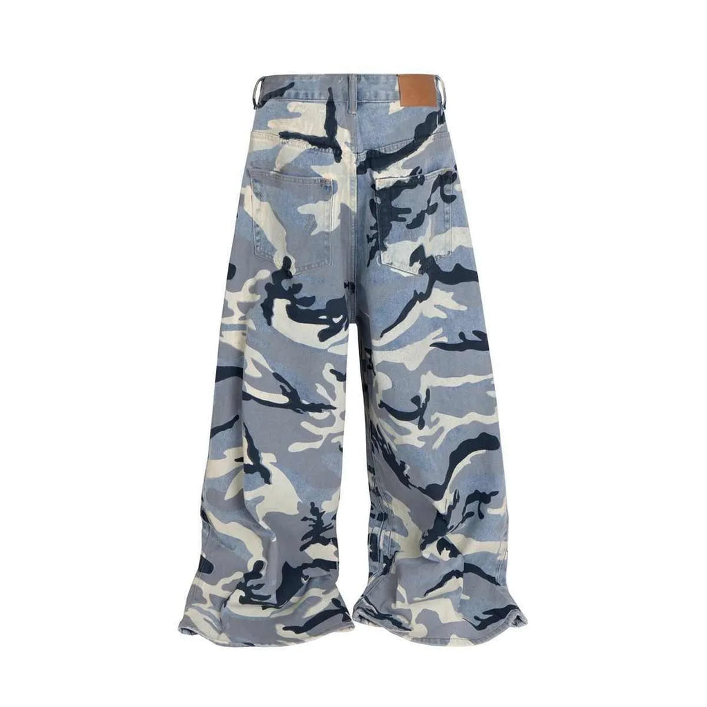 Snow camouflage blue loose-fit denim jeans with a mid-waist, shown on a hanger.