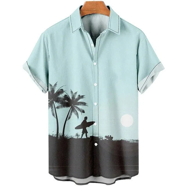 Man wearing a slim fit short sleeve shirt with a colourful 3D floral print, on a beach.