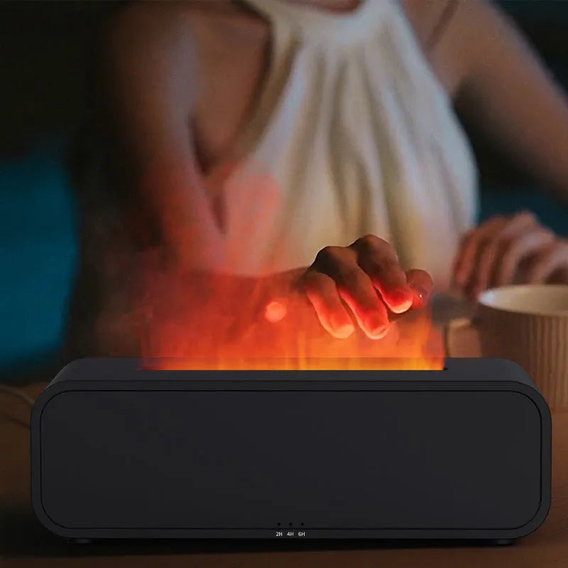 Black and white aroma diffuser with flame effect and colour-changing lights showing remote control