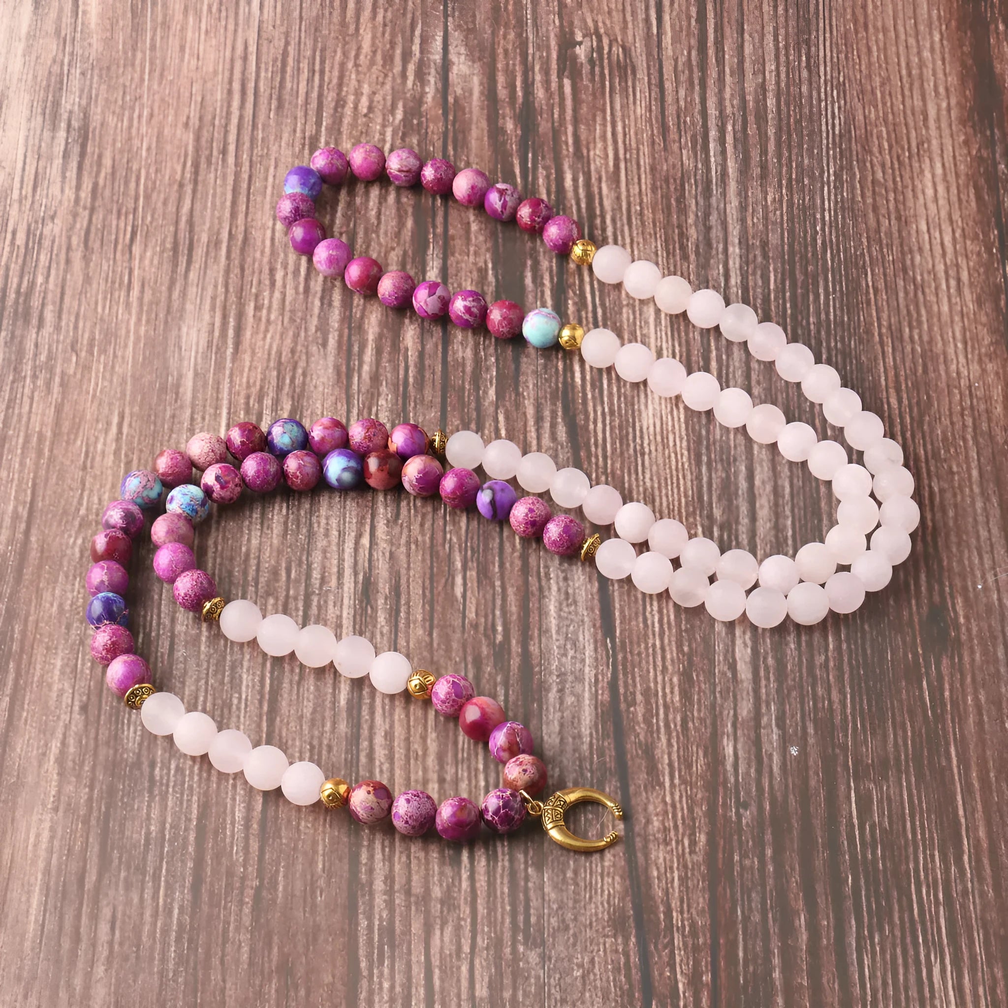 Pink crystal round Emperor Stone beads pendant necklace on a casual unisex cord, approximately 45 cm long