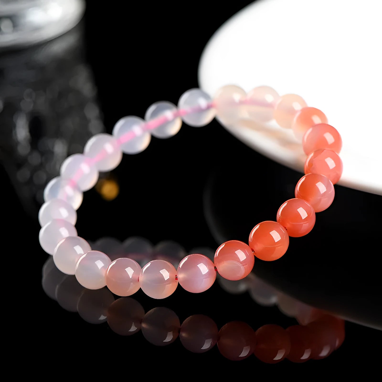 Natural gradient Yanyuan agate bracelet in geometric single-circle design on a neutral background.