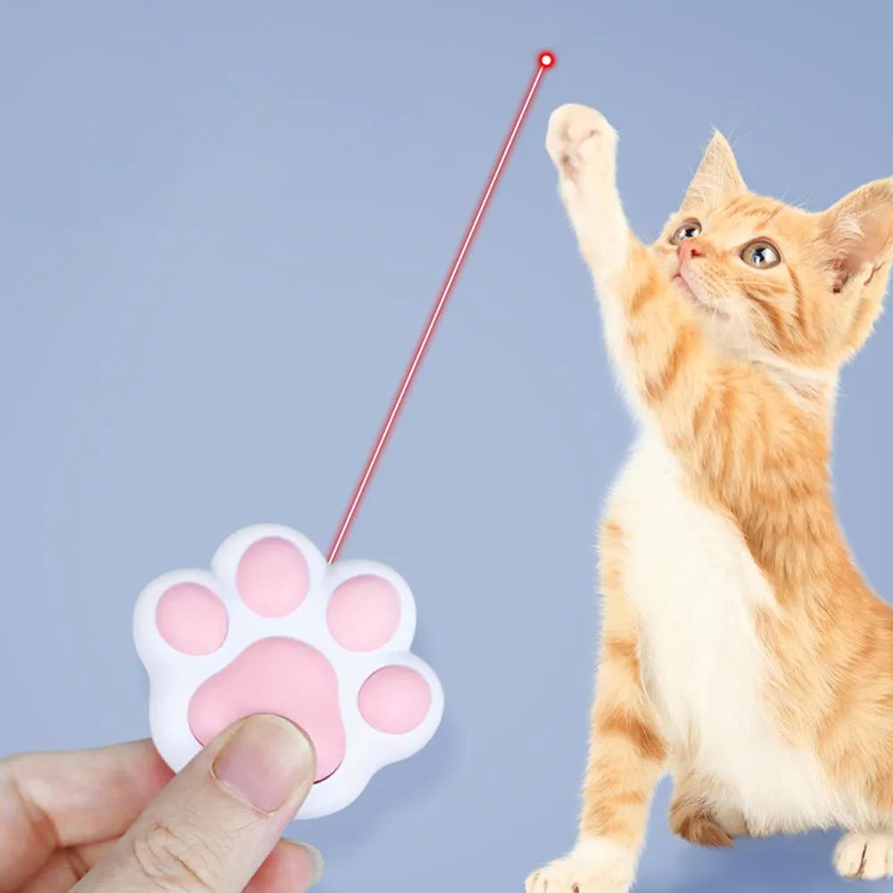 Infrared cat teaser toy with key chain lighting function in black or pink plastic construction