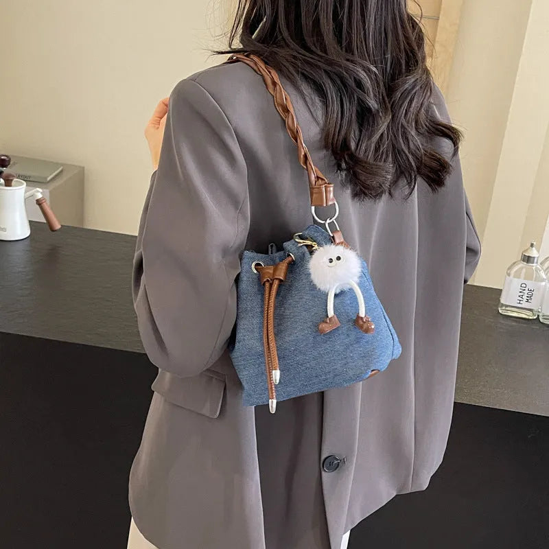 One-shoulder cross body bucket bag in blue colour with synthetic leather lining
