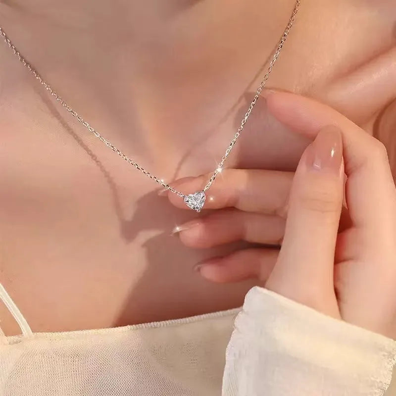 Women's silver heart necklace with simple pendant on chain