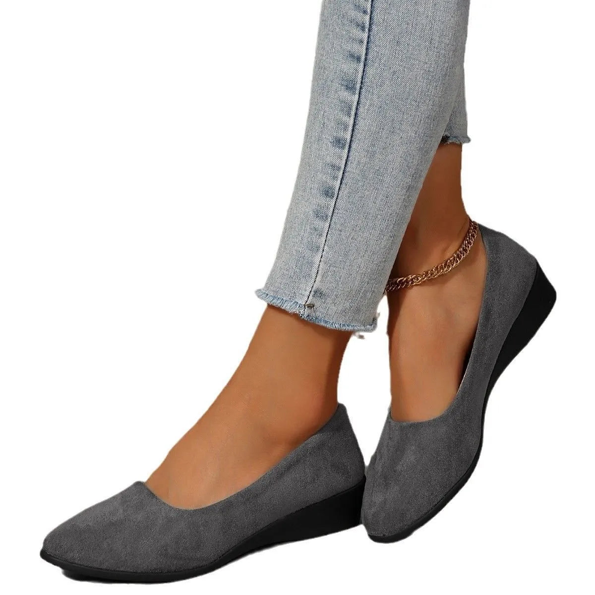 Women's low-heel suede wedge pump in light brown with a round toe and rubber sole.