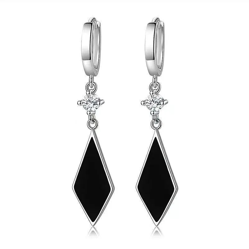 Silver geometric drop ear clip earrings with a vintage diamond pattern.
