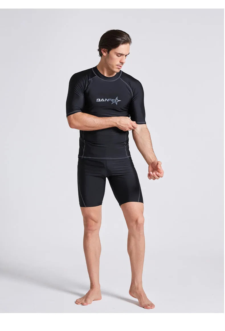 Men's quick-drying half sleeve swimsuit in blue with separate top and pants for snorkelling and surfing