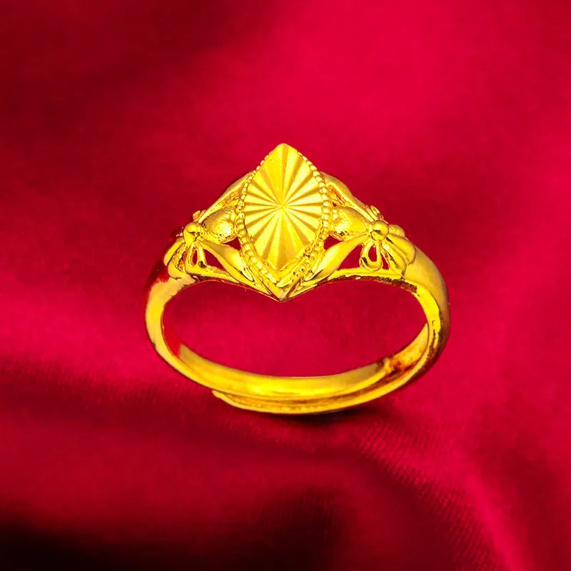 Gold coloured electroplated brass ring with open diamond flower geometry design and texture details