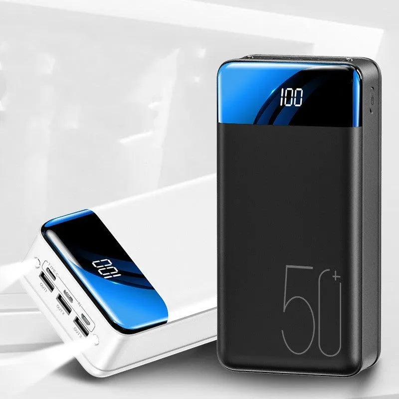 Large black power bank showing three output ports and display screen measuring 169mm