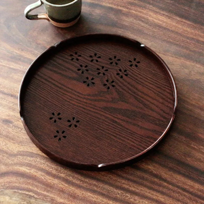 Wooden shallow plate with 12-hole sakura blossom pattern, 30 cm diameter.