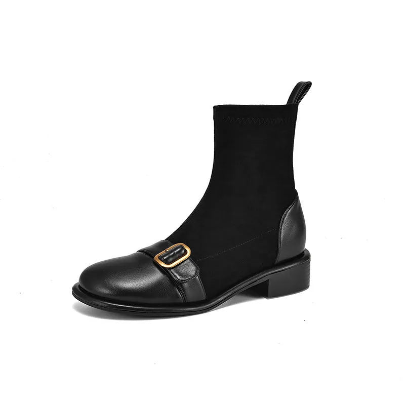 Black women's Martin-style ankle boots with lace-up front, round toe, and low heel on a white background.
