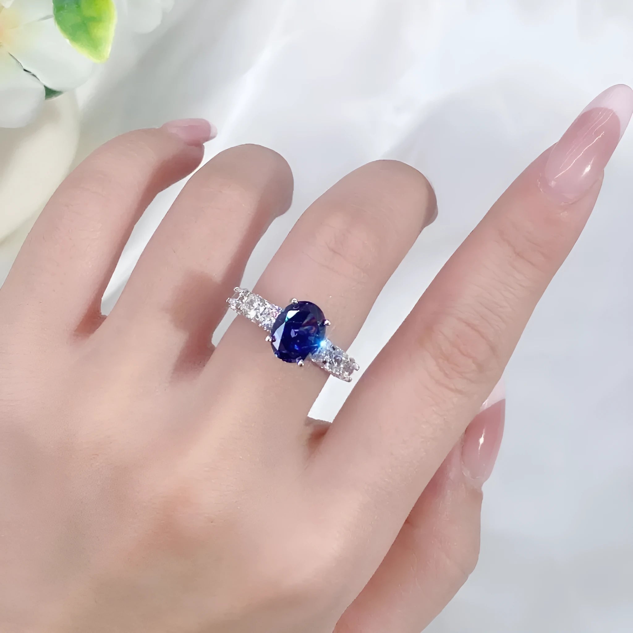 Women's heart-shaped sterling silver ring with an ice flower cut zircon stone in a Tanzanite colour.