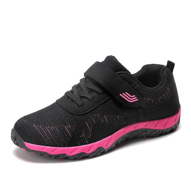 Women's grey purple wedge shoes with Velcro strap and mesh upper on a composite sole.