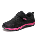 Women's grey purple wedge shoes with Velcro strap and mesh upper on a composite sole.