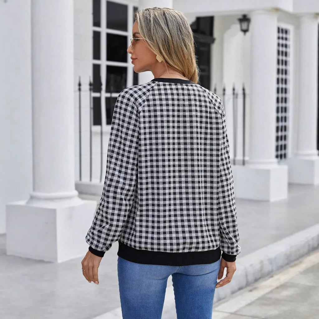 Black polyester pullover sweater with printed plaid pattern and long sleeves