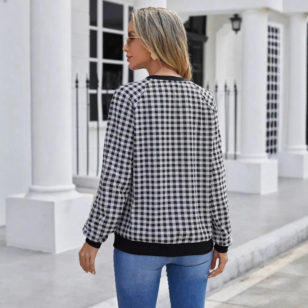 Black polyester pullover sweater with printed plaid pattern and long sleeves