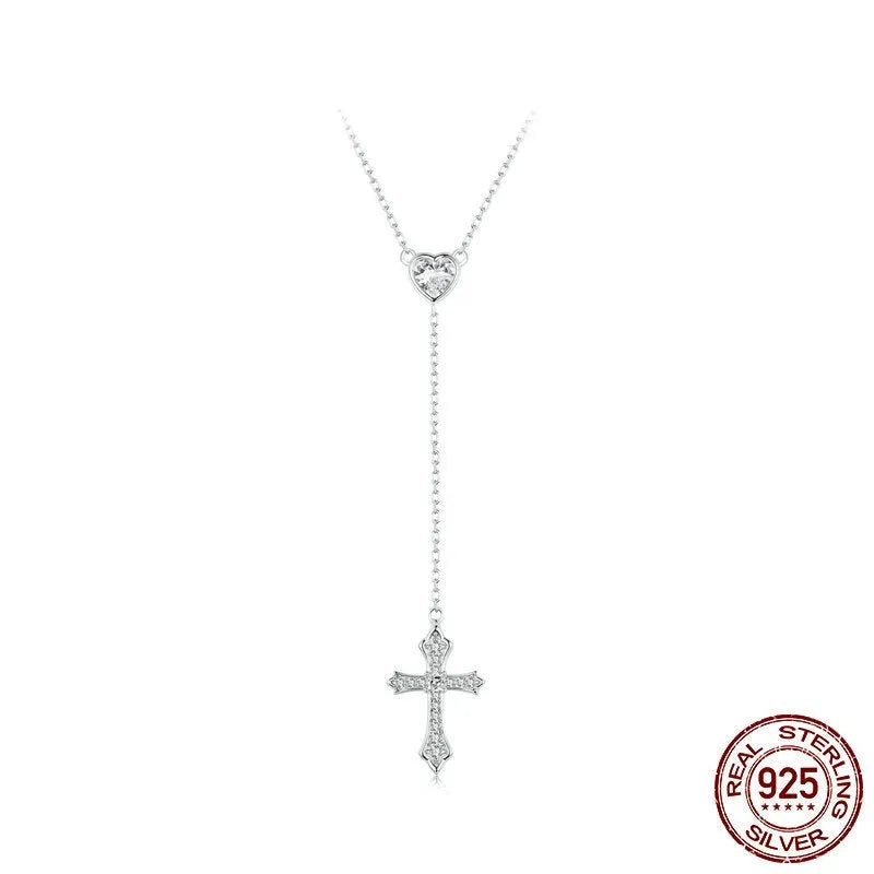 Simple sterling silver cross necklace with V-neck pendant on an O-ring chain.