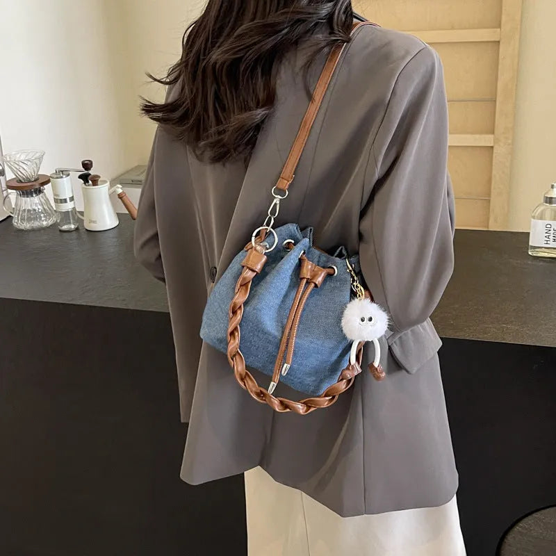 One-shoulder cross body bucket bag in blue colour with synthetic leather lining