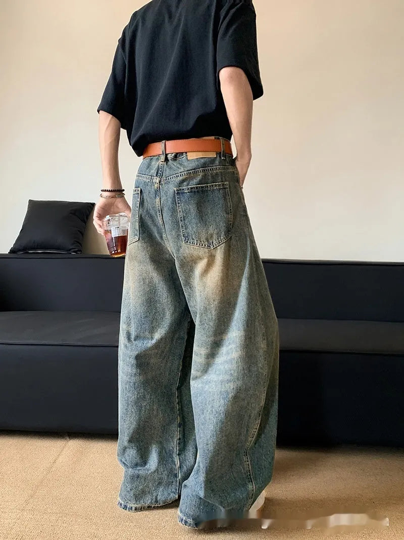 Men's retro blue distressed denim wide-leg pants with vintage styling and slimming silhouette