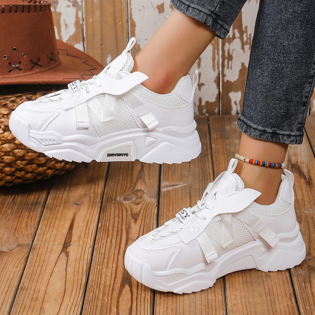 Women's platform sports sneakers in multiple colours with mesh upper and lace-up front.