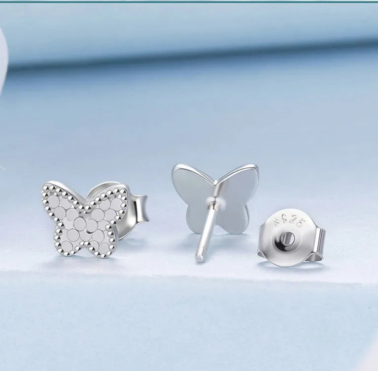 Pair of original S925 sterling silver butterfly stud earrings with shiny electroplated finish on white background