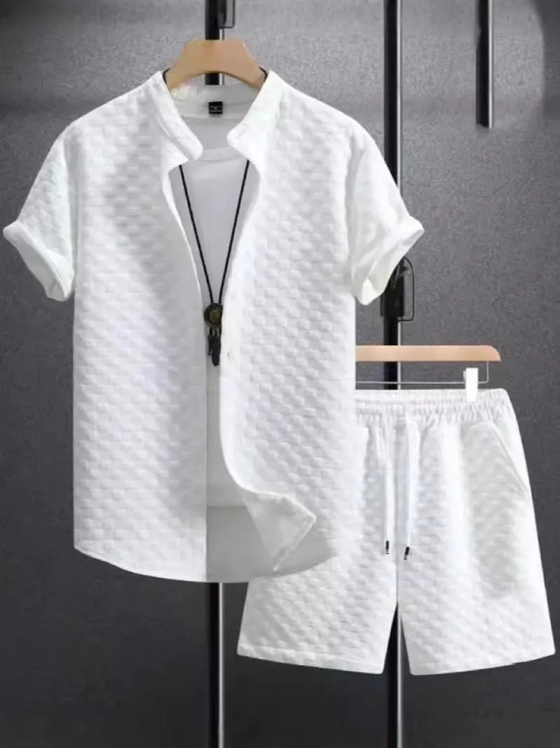 Men's black and white Jacquard print short sleeve suit with matching shorts on a hanger.