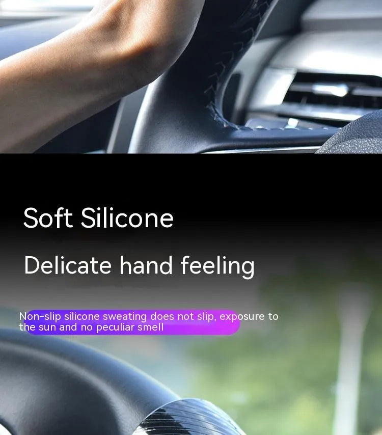 Black and blue steering wheel assist ball with silicone grip and metal bearing for single-handed steering.