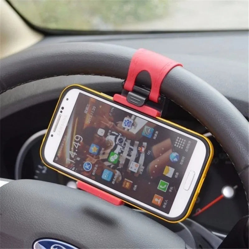 Black steering wheel phone clip holder mounted on car steering wheel