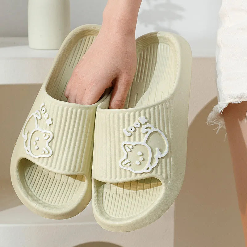Women's green EVA flip-flop slippers with cute cat design and thick platform sole.