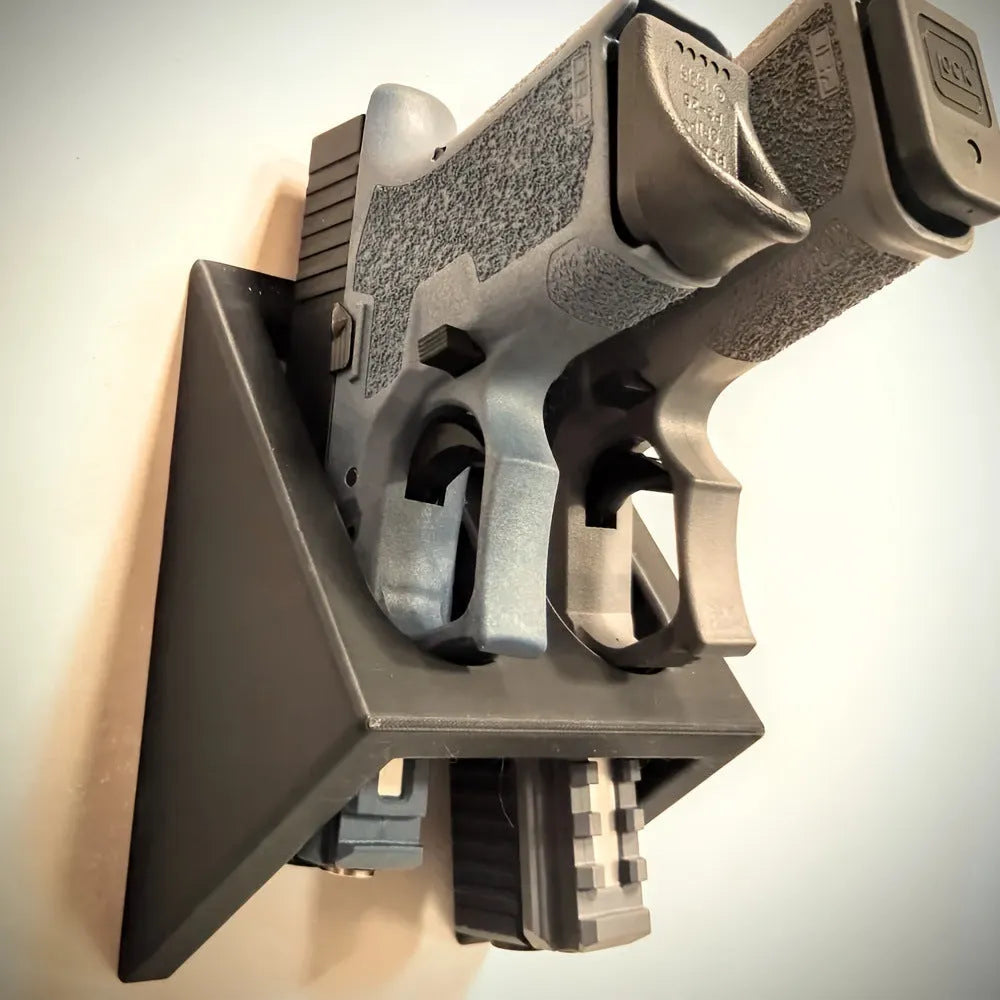 Black plastic punk-style pistol stand for displaying decorative firearms