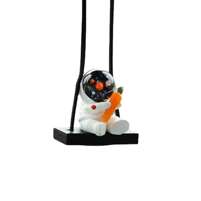 Resin astronaut car pendant with hand-painted cartoon designs in five colour variations