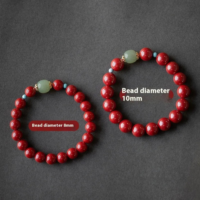 Purple Gold Sand cinnabar Hetian jade bead bracelet in geometric elliptical shape on wrist.