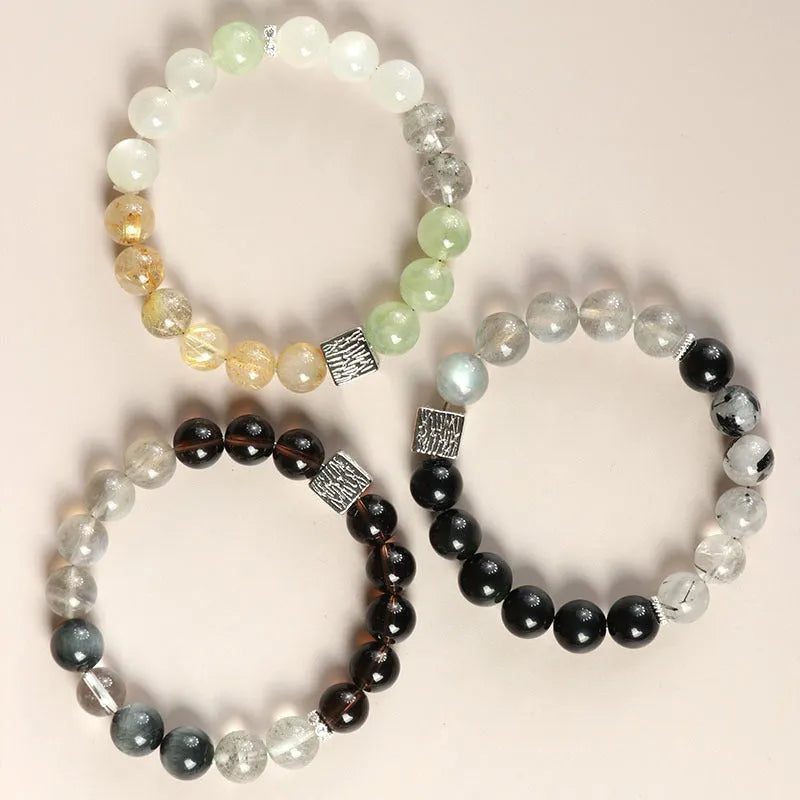 Polished crystal bracelet in khaki with 10mm geometric beads on a neutral background