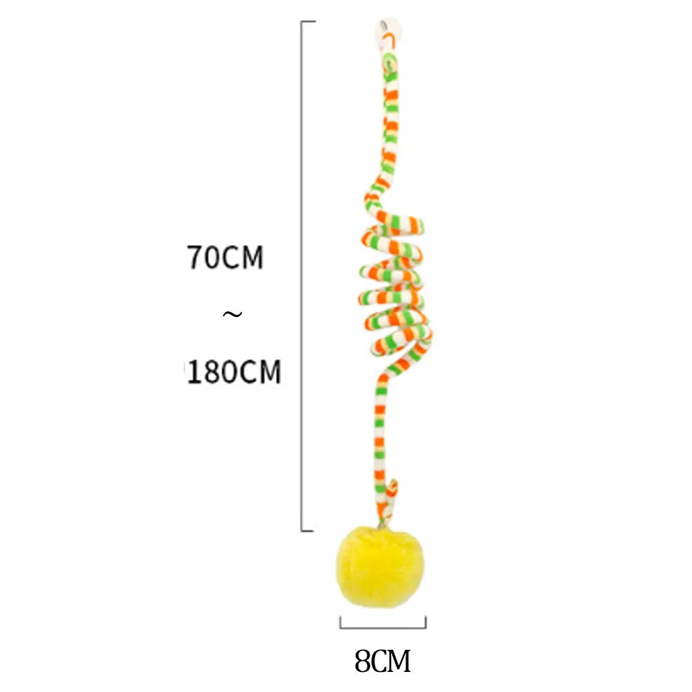 Cat toy with inflatable ball and bell stick hanging from door with suction cup attachment