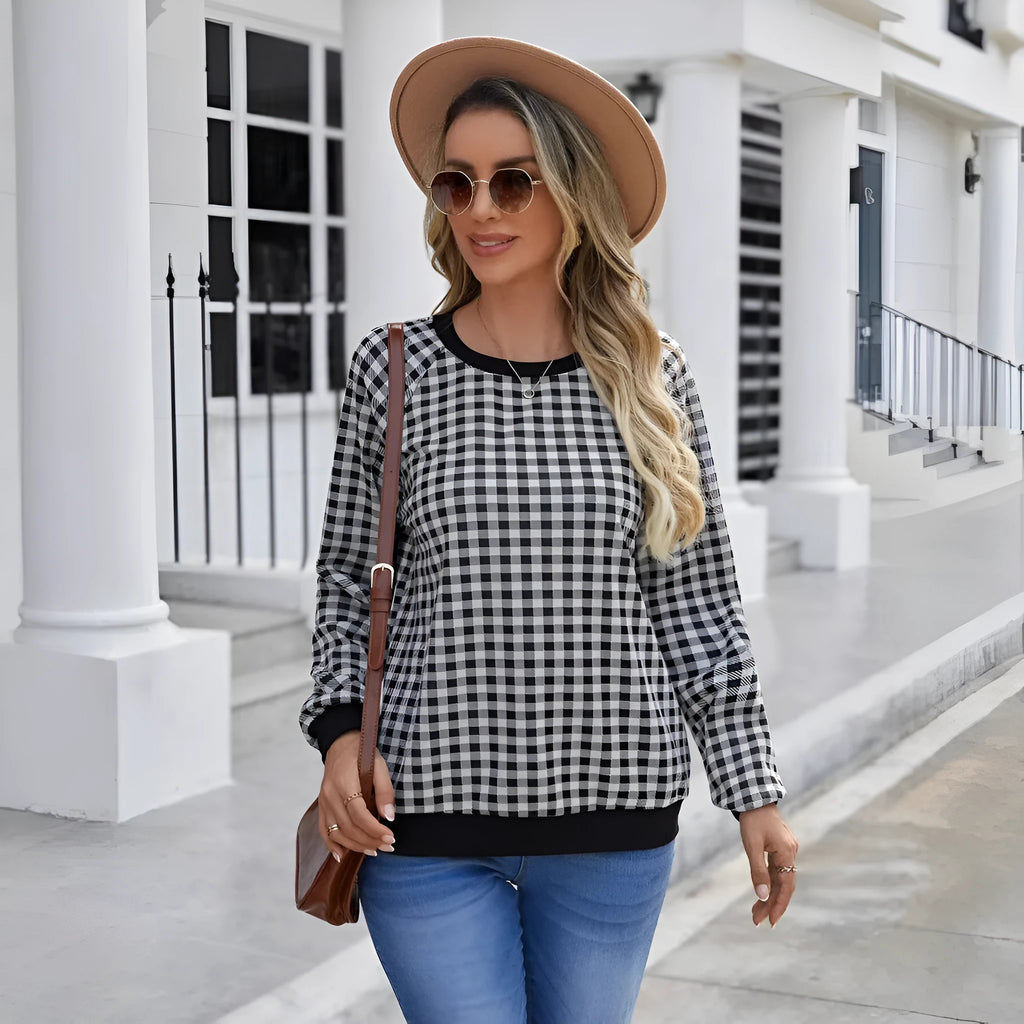 Black polyester pullover sweater with printed plaid pattern and long sleeves