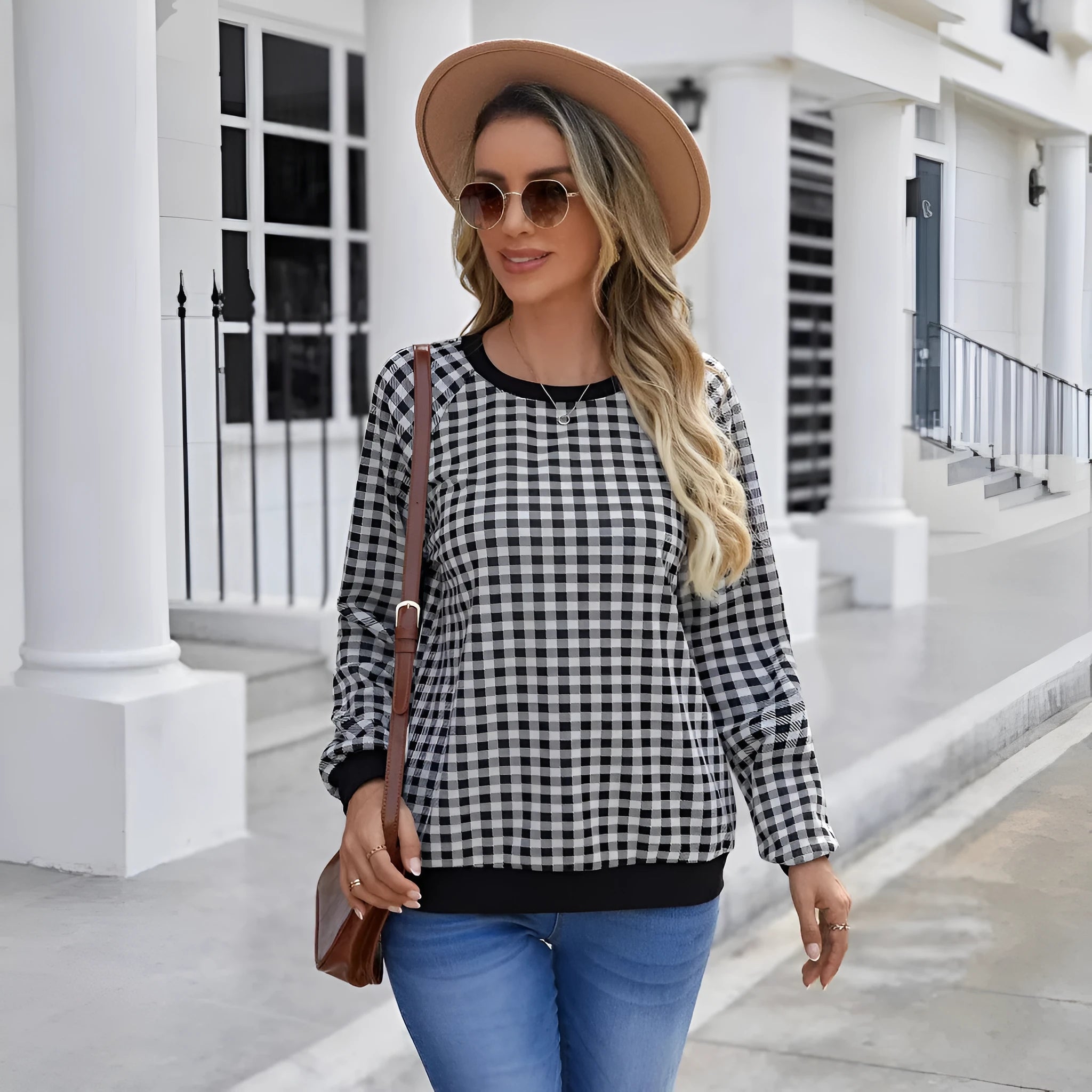 Black polyester pullover sweater with printed plaid pattern and long sleeves