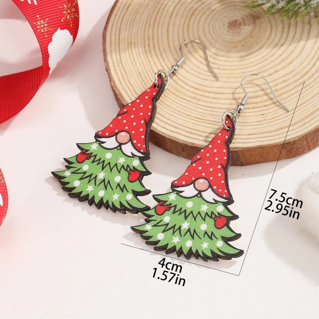 Women's wooden Christmas earrings with printed tree and snowman designs on geometric shapes.