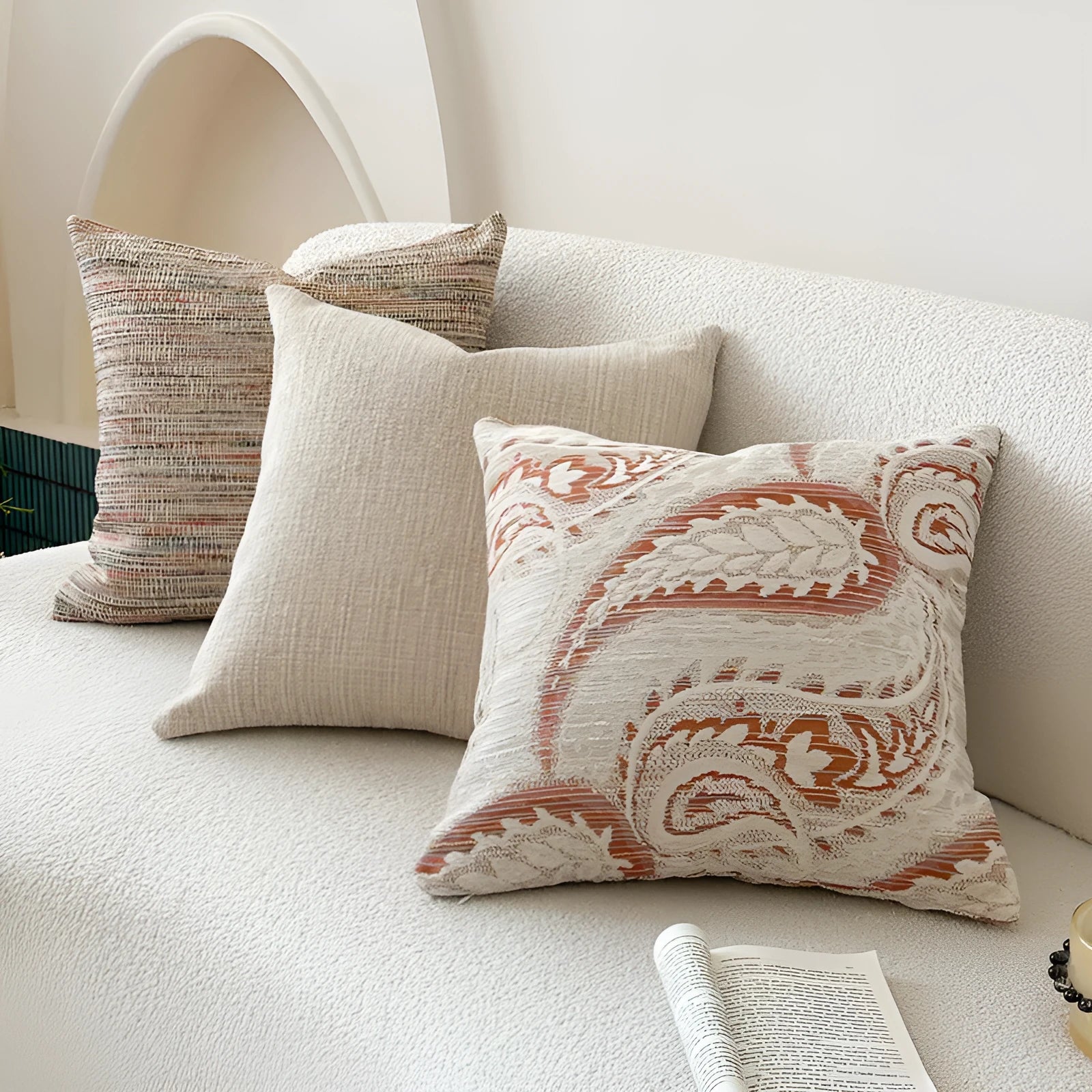 American-style amber jacquard pillow cover with paisley plant pattern, shown on a sofa.