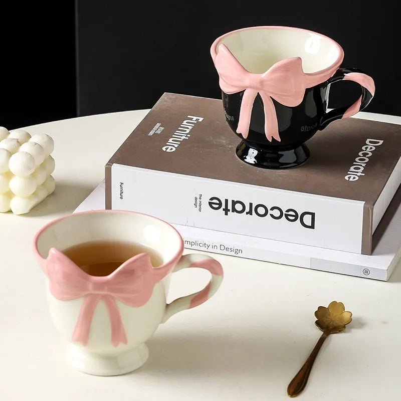 Ceramic mug with girl heart bow decoration in white powder or black pink colour, 301-400ml capacity.